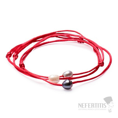 A set of three fashion bracelets with pearls on a red string