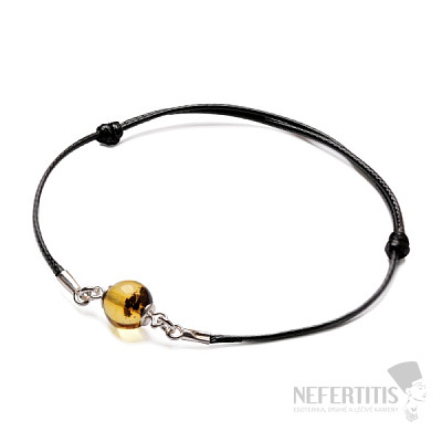 Fashionable string bracelet with a green amber bead and Ag 925 silver