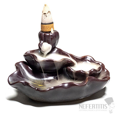 Stand for incense cones with flowing Lotus smoke