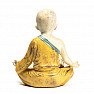 Buddhistický mnich soška chlapce ve žlutém hávu kolorovaná